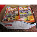 A collection of Gun Mart magazines from various years