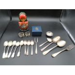 Collectors lot - to include a Russian doll, plated flatware items two napkin rings and a boxed