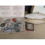 A box of costume jewellery and pearls