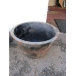 A cast iron cauldron/water pot