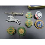Lapel badges British field sports x 3, Pony club badge, West Norfolk Hunt, a racing horse brooch and