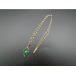 A 9ct gold necklace and pendant with green stones