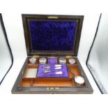 A Burr walnut veneered ladies travel vanity trinket case, with contents - to include cut glass