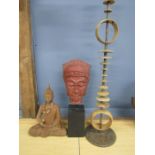 Tribal head on plinth, Deity, candle holder and a blue Buddha