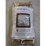 A Millennium cross stitch kit complete with wooden frame and sewing items