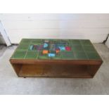 Retro tile topped coffee table on wheels H42cm Top 51cm x 111cm approx