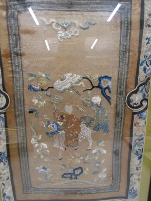An Oriental silk embroidery framed and glazed 79x54cm - Image 2 of 2