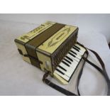 A Hohner student 1 piano accordion steel reeds and leather strap