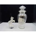 A double spouted decanter with silvered ship design and a glass horse stamped at base