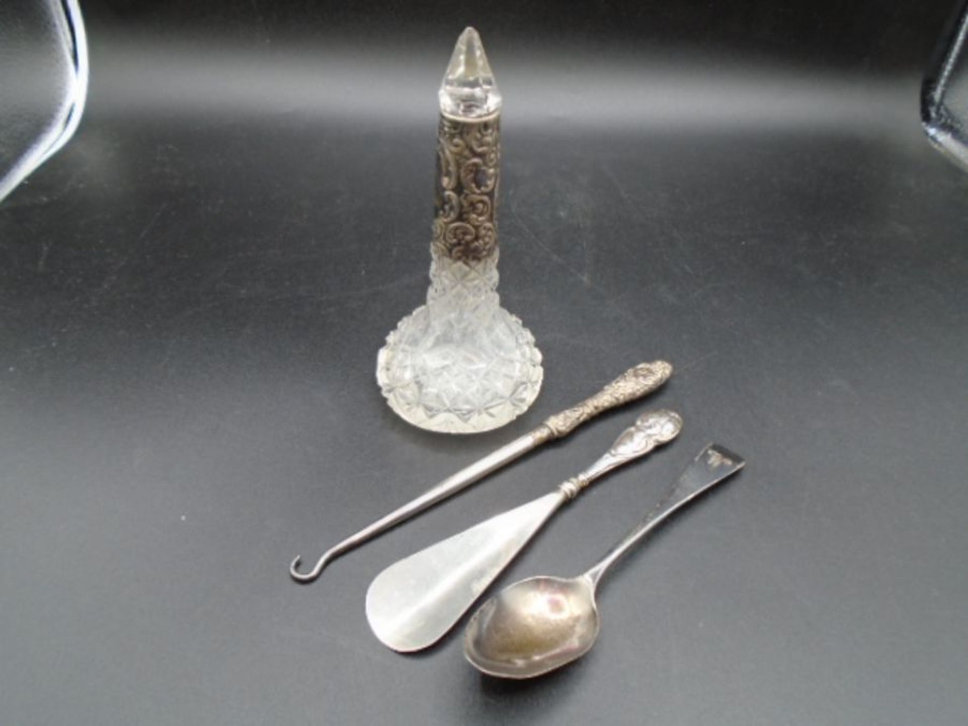 A silver collared glass scent bottle (Sheffield, 1903 by Walker & hall) has slight chip to stopper