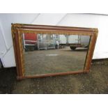 Oak framed over mantel mirror with ornate gilt detail  64cm x 103cm approx