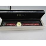 Stauer watch in case and box with certs