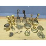 Brass lot to include horse brasses, candle snuffer and hand bells