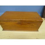 A wooden box with drawer compartment