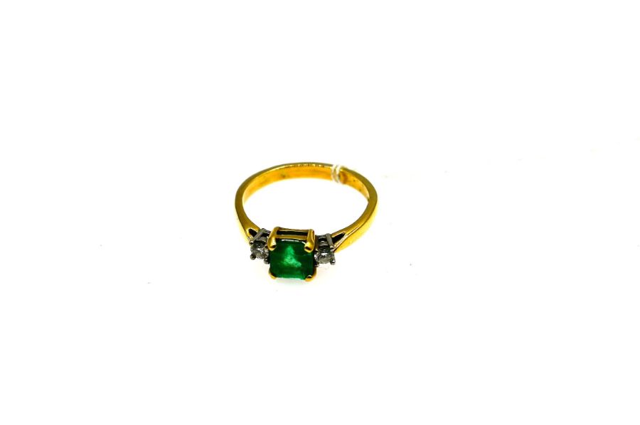 18ct yellow and white gold ring ring with Emerald (6.5mm x 6.5mm) and a claw set diamond on each