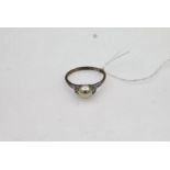 18ct white gold dress ring with a 7.2mm cultured pearl and three diamonds on each shoulder size U (