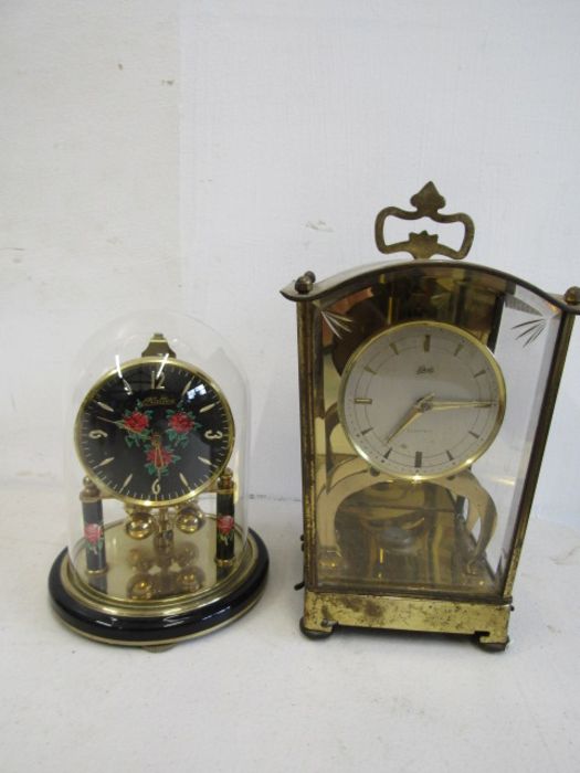 Schatz electric clock and Haller anniversary clock in dome