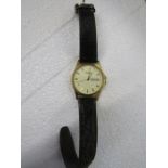 Mens Rotary day/date wristwatch with gold toned and face leather strap  (strap slightly perished)