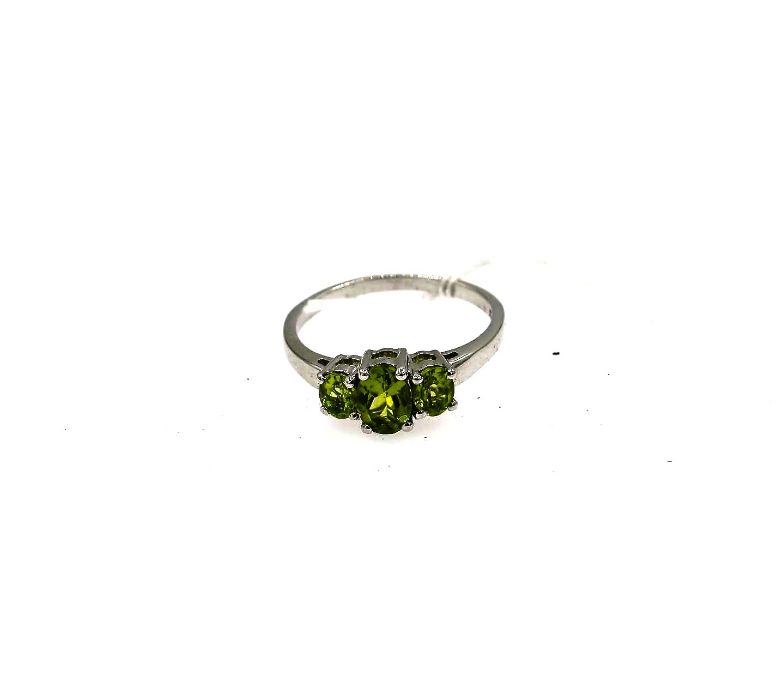 Silver dress ring with 3 graduated claw set oval peridots