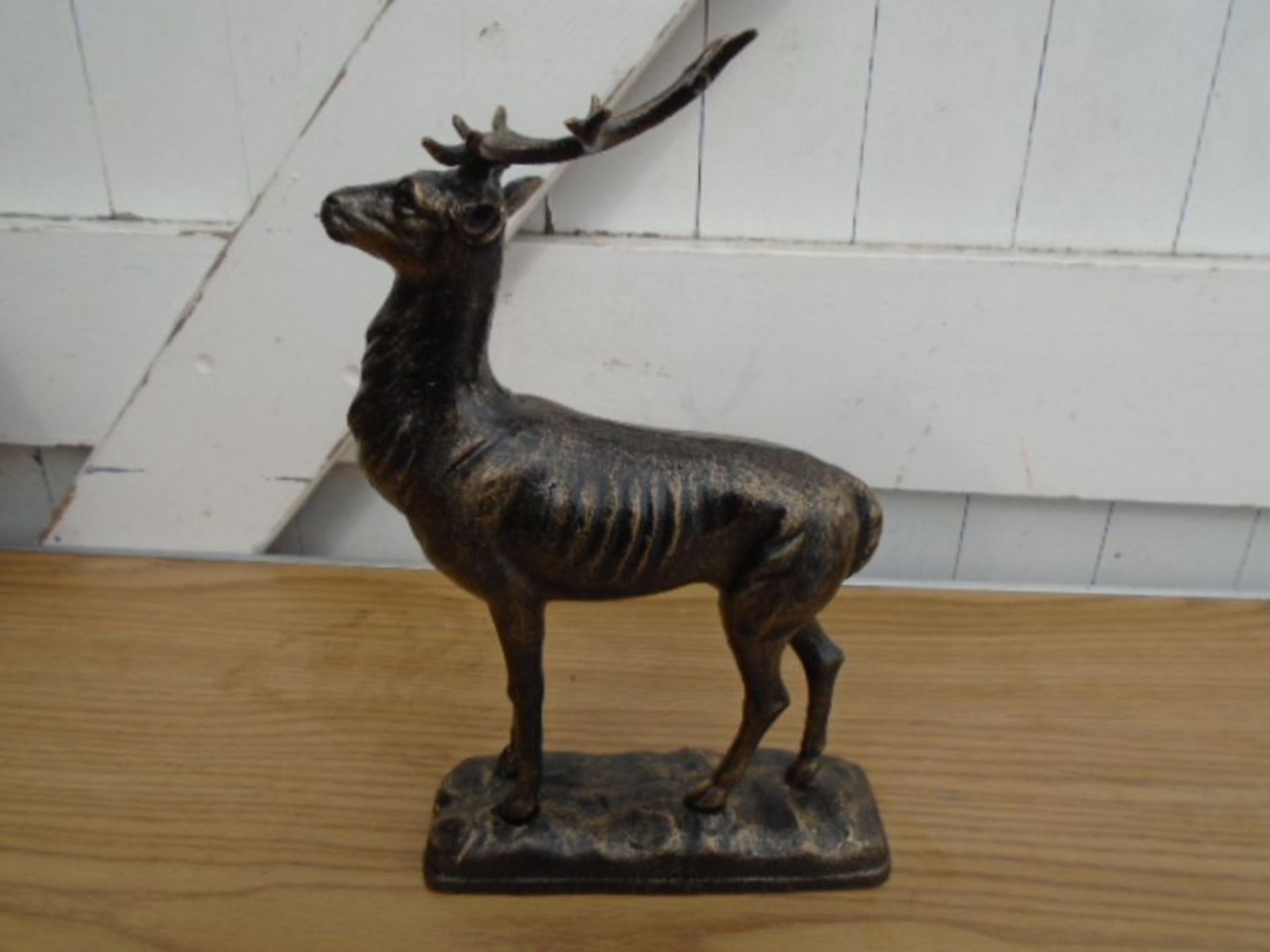 Cast deer on base figure