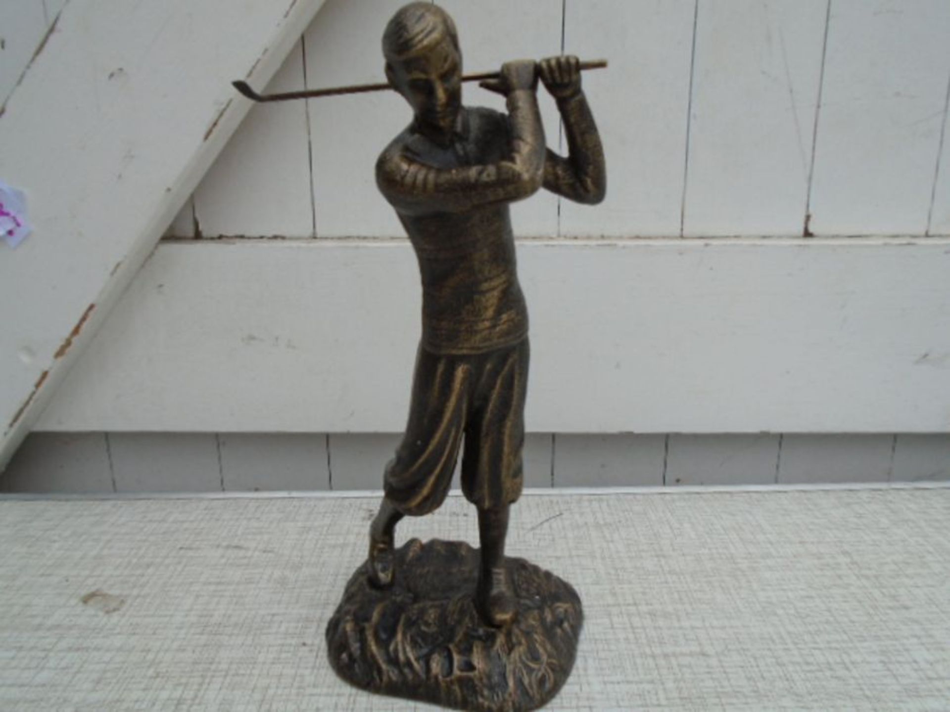 Bronzed finish golfer figure