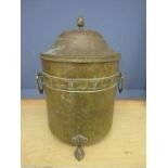 A brass coal bin with lid