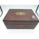 A wooden jewellery box with Mother of pearl inlay to the top. Box has green velvet to inner lid some