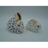 2 Royal Crown Derby blue and gold paperweight rabbits with stoppers