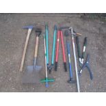 Garden tools to include pick axe and shovel etc