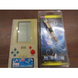 Retro hand held games console and a Dr Who sonic screwdriver torch