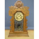 Wooden cased clock with key 58cmH