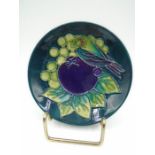 Moorcroft pin tray with finch and fruit pattern in green and purple colours with impressed marks