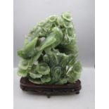 Carved Jade blossom tree with birds on a wooden plinth approx 10"W x 11"H
