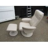 Swivel recliner armchair with footstool