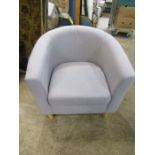 A grey tub chair