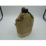 A Water canteen stamped 'Korea' on the base has some dents, plus a pouch also marked 'Korea' on