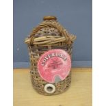 Wicker encased flagon with label H40cm approx