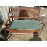 Garden bench with cushions and lift up storage seat