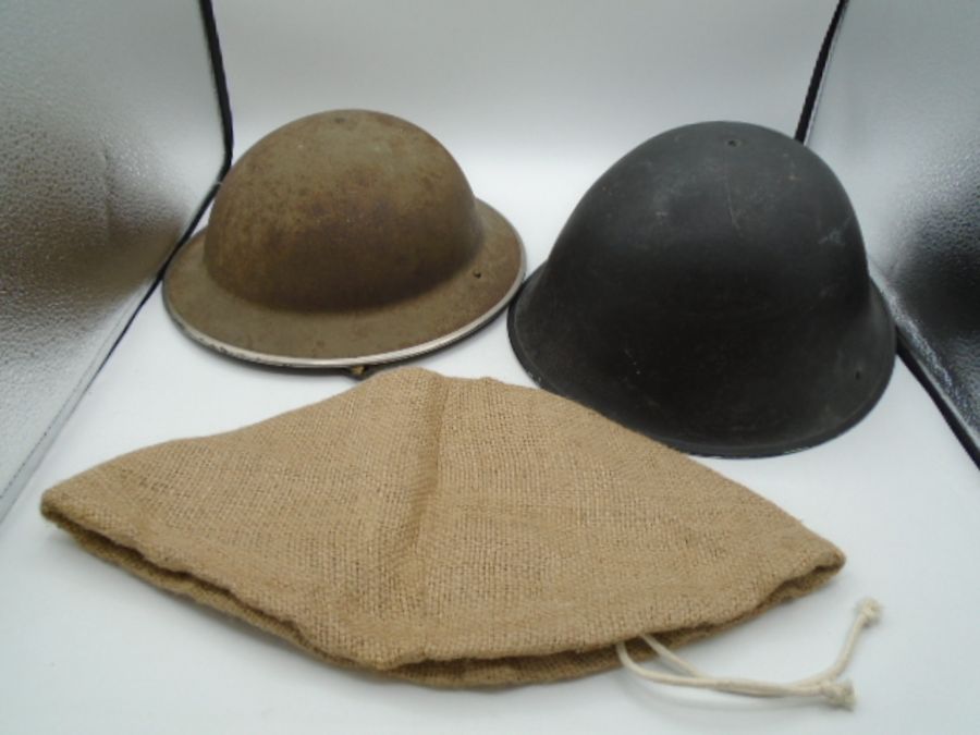 WW2 stamped 1941 mk.II Brodie helmet, plus a British mk. VI helmet C.1950's and a repro hessian