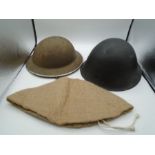 WW2 stamped 1941 mk.II Brodie helmet, plus a British mk. VI helmet C.1950's and a repro hessian