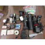 A collection various lenses and photography accessories