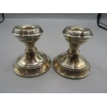 A pair silver candle sticks (weighted)  some dents as pictured