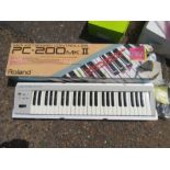 Roland keyboard in original box with lead