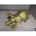 large hollow brass pig