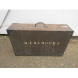 Vintage wooden suitcase with the name R. Colbourn