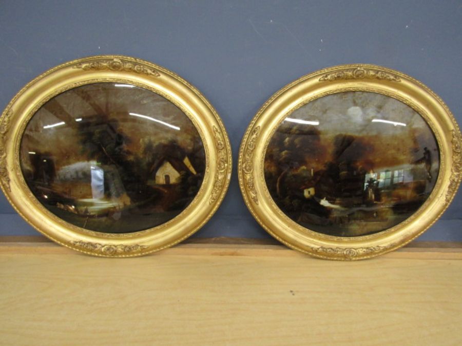A pair tin paintings on reverse glass in gilt frames 58x50cm