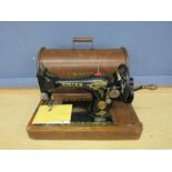 Vintage Singer sewing machine in case with key