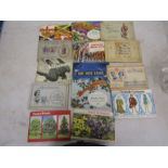 A collection of cigarette card booklets