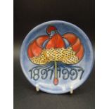 Moorcroft Pottery Centenary 1897-1997 pin tray dish featuring a red and yellow flower on a light