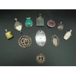 A collection of 11 silver pendants most marked 925, one hallmarked Sheffield 2004 by Francis